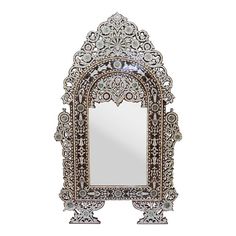 an ornate mirror is shown against a white background