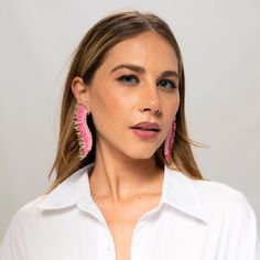 Step out in style with these Pink Gold statement Wing Earrings - a perfect balance of cuteness and elegance. Women will love the unique combination of whimsy and luxury with the playful baby pink hue and opulent golden tones. The one-of-a-kind earrings are designed in the shape of angel wings, adorned with layers of sequins arranged around a single stud. Be a true statement-maker with these handmade, beaded statement earrings. Size: Length: 3.5''/ Width: 1'' Pink Bohemian Earrings For Party, Bohemian Pink Earrings For Party, Pink Bohemian Party Earrings, Bohemian Pink Party Earrings, Feminine Party Earrings With Ear Wire, Elegant Pink Drop Plug Earrings, Elegant Pink Dangle Hoop Earrings, Playful Jewelry With Matching Earrings For Party, Elegant Pink Hoop Earrings For Pierced Ears