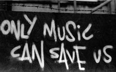 the words only music can save us written in white spray paint