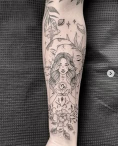 a woman's leg with tattoos on it