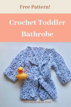 a crochet toddler bathrobe with a rubber ducky on it