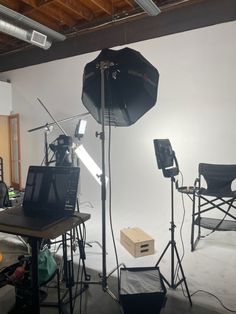 an empty studio with several lighting equipment