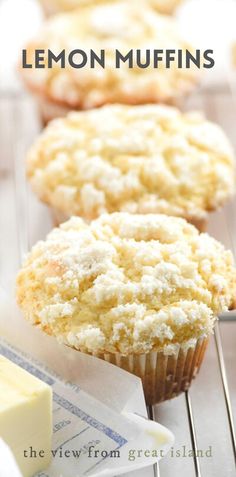 lemon muffins on a wire cooling rack with butter and other pastries in the background