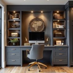 a home office with built - in desk, shelves and drawers on both sides is shown