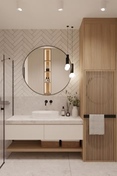 a bathroom with a mirror, sink and shower stall in it's center area