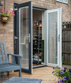 an open door to a wine cellar on a deck