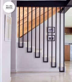 the stairs in this house are made from metal bars and wood slat railings