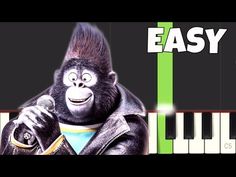 an animated gorilla holding a microphone and standing next to a piano with the words easy piano