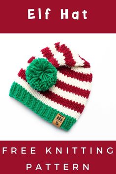 a knitted hat with a green and red pom - pom on it