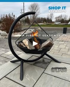 a fire pit sitting on top of a sidewalk