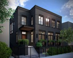 a two story black house with lots of windows