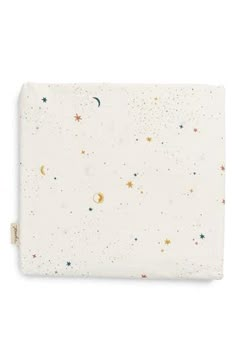 a white blanket with stars and planets on it