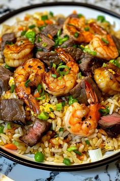 a plate with rice and shrimp on it