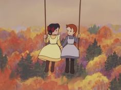 two children sitting on swings in an autumn forest