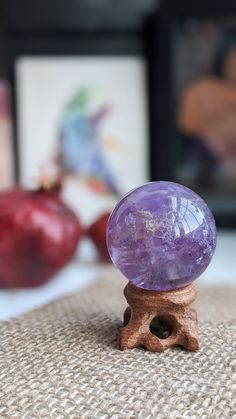 This gorgeous amethyst sphere is beautifully clear and loaded with rainbows from many angles. It is from our personal collection. Please see video for more details.  It measures 43 mm in diameter.  These are natural stones, so please understand there may be slight flaws. ----- About us: We are a couple of besties sharing our mutual loves of bones, crystals, and plants. Everything in the shop is either handmade or hand-selected with intent.  We do not use filters on any of our photos! We do choose the lighting (indoor, outdoor, time of day) that will highlight the item best, but everything we photograph is taken without filters, and will be clearly labeled as to whether you are getting this exact item or a similar one (in case of plants or crystals) We ship once a week due to our day jobs. Amethyst Crystal Gift, Round Purple Crystals For Gifts, Purple Round Crystals For Gift, Round Purple Crystals For Gift, Crystal Healing Chart, Amethyst Sphere, Red Jasper, Packing Material, Crystal Items