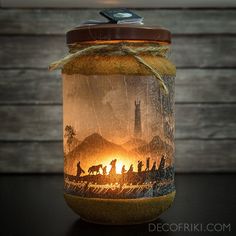 a mason jar with a scene painted on it