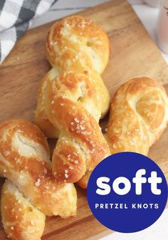 several pretzel knots on a cutting board with the words soft pretzel knots