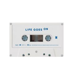 an old white cassette with the words life goes on printed on it's side