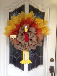 a door hanger with a turkey on it's head and burlocks