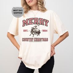 Western Merry Christmas Shirt, Western Christmas t-shirt, Country Christmas t-shirt, Cowboy Christmas t-shirt, Comfort Colors ABOUT US: -------------- ✔ Seeking personalized, comfy, and soft shirts? Express yourself with our T-shirts! With various colors, sizes, and unique designs, create a shirt that embodies you. Contact us for any queries; we'll respond promptly. HOW TO ORDER: ---------------------- ✔ To order, check the color, size, and description. Follow these steps: * Select size and color from the dropdown menu. * If customization is available, tick the personalization box and enter requested info. * Choose quantity and add to cart. * Proceed to checkout and select preferred shipping speed. ✔ Size and color charts in product pictures. If your desired size or color isn't listed, con Cowboy Christmas, Western Christmas, Merry Christmas Shirts, Create Shirts, Cow Boy, Christmas T Shirt, Image Transfer, Country Christmas, Branded Shirts