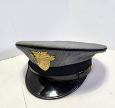 Art Caps Military Headware West Point hat.  No size.  Opening is 7.25x6.5in.  Condition shows wear and use with scratches, scuffs, and stains/discoloration.  Great piece to display in a man cave, bar, garage, hobby room, or workshop! Grey Formal Dress, Vintage Man Cave, Retro Helmet, Vintage Man, Hobby Room, West Point, Man Cave Bar, Formal Dress, Man Cave