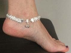 Luminous silver metal anklet chain, small feathers pattern, clasp with small bells Silver Bohemian Metal Anklets, Handmade Silver Metal Anklets, Handmade Silver Dangle Anklets, Metal Anklets For Festival, Festive Metal Anklet With Silver Beads, Bohemian Silver Anklets As Gift, Silver Bohemian Anklets For Party, Bohemian Nickel-free Silver Anklet, Silver Toe Ring Anklets For Festivals