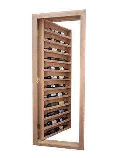 a wooden wine rack with several bottles in it and an open door to the side