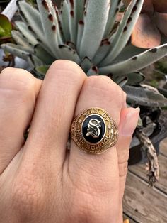 "This size 7 Vintage Class Ring. This vintage class ring is from Shelby High School in 1944 and is a 10kt gold estate ring. With the letter \"S' boldly pronounced it really shows off its vintage class ring qualities. The initials MJB are engraved on the inside and underneath the ring, the bezel has been loved and is slightly damaged(view photo above). However, this signet upcycled ring does fit comfortably and is ready to be loved for many more timeless years to come. All of our rings are sent in a beautiful ring box and are unpolished unless otherwise requested.  In addition, inquire about re-sizing.  As a third generation jeweler, my passion for vintage, antique and estate jewelry is why Timeless Estate Jewelry exists. I love seeing jewelry lovers cherish these timeless pieces and give t Upcycled Rings, High School Rings, School Rings, College Rings, Class Rings, Estate Rings, View Photo, Signet Rings, Ring Antique