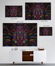 three canvases with different colors and patterns on them, hanging in a white room