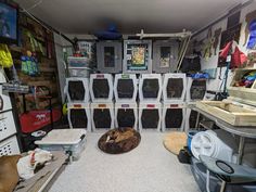 a room filled with lots of different types of storage bins and boxes on the wall