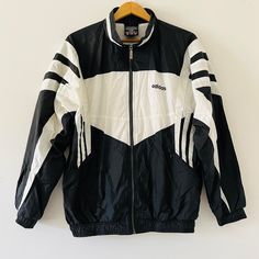 Vintage 90's Adidas Predator Black and White Three Stripe Zip Up Windbreaker Training Jacket Size Large Y2K Fashion Vintage 90s Adidas shell jacket in black and white stripes. This is the colourway that everyone thinks of when you say 90s Adidas, it was everywhere. Similar to Liverpool football kit of the early 90s. Jacket features full zip, zipped pockets and elasticated hem and cuffs. A very smart Adidas jacket! Please view pictures as part of the description. All vintage items are final sale. Zip Up Windbreaker, 90s Adidas, Adidas Zip Up, 90s Jacket, Adidas Vintage, Liverpool Football, Shell Jacket, Fashion Vintage, Y2k Fashion