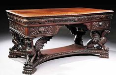 an ornate wooden desk with carvings on it