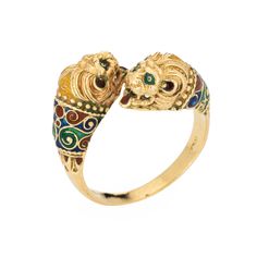 Stylish vintage double Lion ring crafted in 18 karat yellow gold (circa 1980s).  The elaborate double Lion features a blue, green and orange enameled patterned body, The double headed Lion bypass design makes a great statement on the hand. The low rise ring (7.5mm - 0.29 inches) sits comfortably on the finger. Great worn alone or stacked with your fine jewelry from any era.  The ring is in good condition and was lightly cleaned and polished.  Particulars: Weight: 9 grams Stones:  N/A  Size & Mea Masonic Jewelry, Russian Jewelry, Antique Jewelry Rings, Lion Ring, Head Ring, Art Nouveau Jewelry, Deco Jewelry, Victorian Jewelry, Gold Enamel