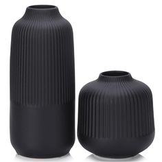 two black vases sitting next to each other