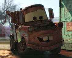 the mater from cars is smiling for the camera