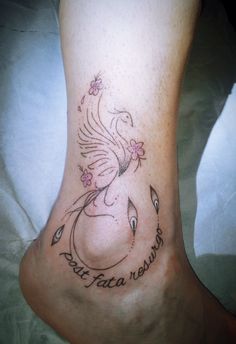 a woman's foot with a tattoo on it