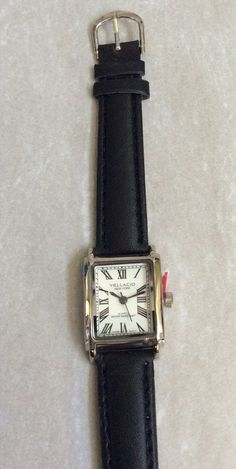 Vellacio women's silver rectangle watch, having a Rectangle white dial, displaying easy to read Roman Numeral Hours, all on a black leather band. This is a New unused Vintage Watch, works perfectly, ready to be cherished & enjoyed and keep you up with accurate on-time display! Measurements: Bezel/Case 1 1/8" x 3/4", Dial 3/4" x 5/8", Band Width 1/2" and fits a 5 1/2" up to a 7" wrist. We ship fast, the next business day for a quick delivery to you. May you have a wonderful time shopping, best wishes! Cheap Modern Rectangular Watch, Rectangle Watch, Hand Watch, Roman Numeral, Women Wrist Watch, Women's Watch, White Dial, Roman Numerals, Quick Delivery