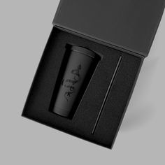 a cup in a black box with the lid open