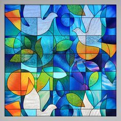 a colorful stained glass window with birds and leaves