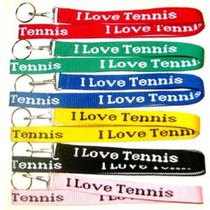 several lanyards with love tennis written on them