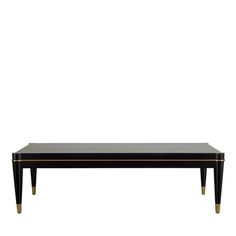 a black coffee table with gold trimmings on the top and bottom, against a white background