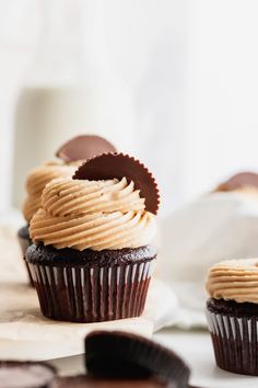 two chocolate cupcakes with peanut butter frosting