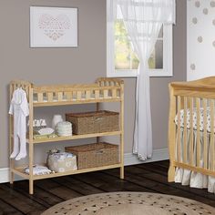 a baby's room with two cribs in it