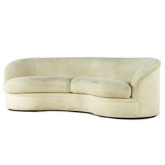 the curved couch is made from white fabric