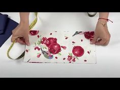 a woman is measuring her fabric with a tape measure and scissors on top of it