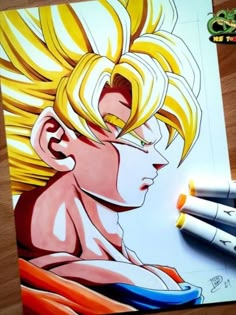 an image of a drawing of gohan from dragon ball super broly with crayons next to it