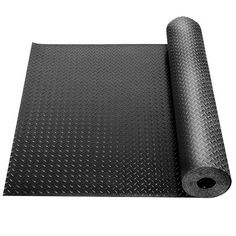 a roll of black rubber mat on top of a white background