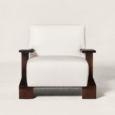 a white chair sitting on top of a wooden frame