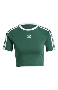 A center Trefoil logo and 3-Stripes at the sleeves root this sporty, cropped T-shirt in heritage adidas style. Crewneck Short sleeves 94% cotton, 6% elastane Machine wash, dry flat Imported Adidas Clothes, Korean Life, Dress Reference, Mineral Green, Adidas Adicolor, Adidas Short, Green Crop Top, Adidas Fashion