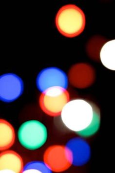 blurry image of colorful lights in the dark